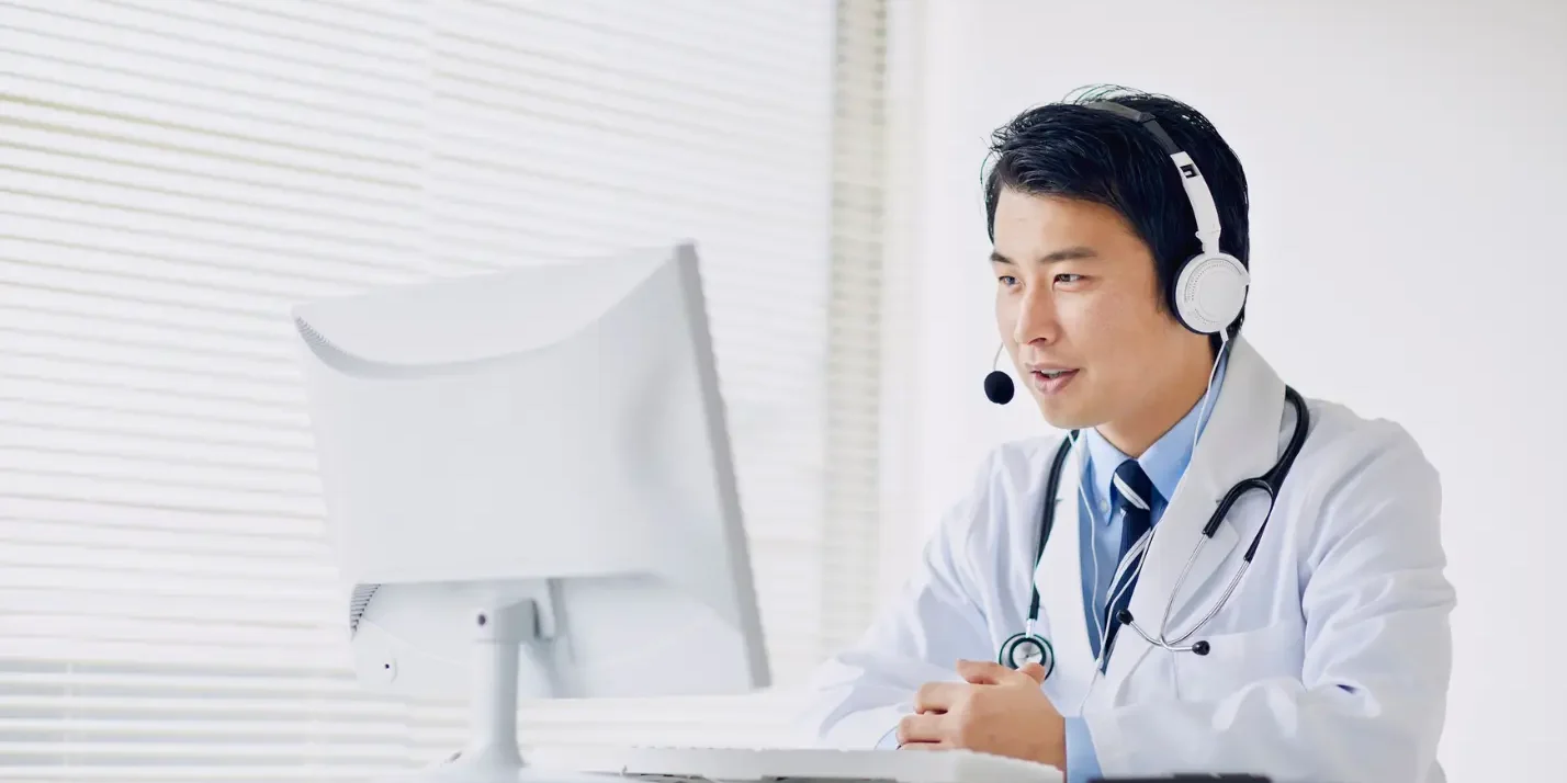 Doctor conducting a telemedicine consultation using a computer
