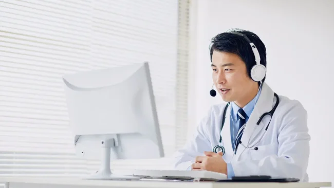 Doctor conducting a telemedicine consultation using a computer