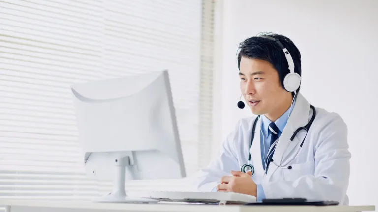 Doctor conducting a telemedicine consultation using a computer