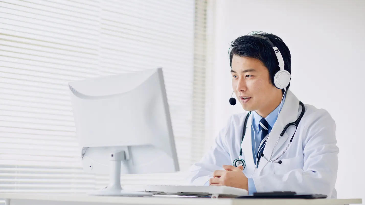 Doctor conducting a telemedicine consultation using a computer