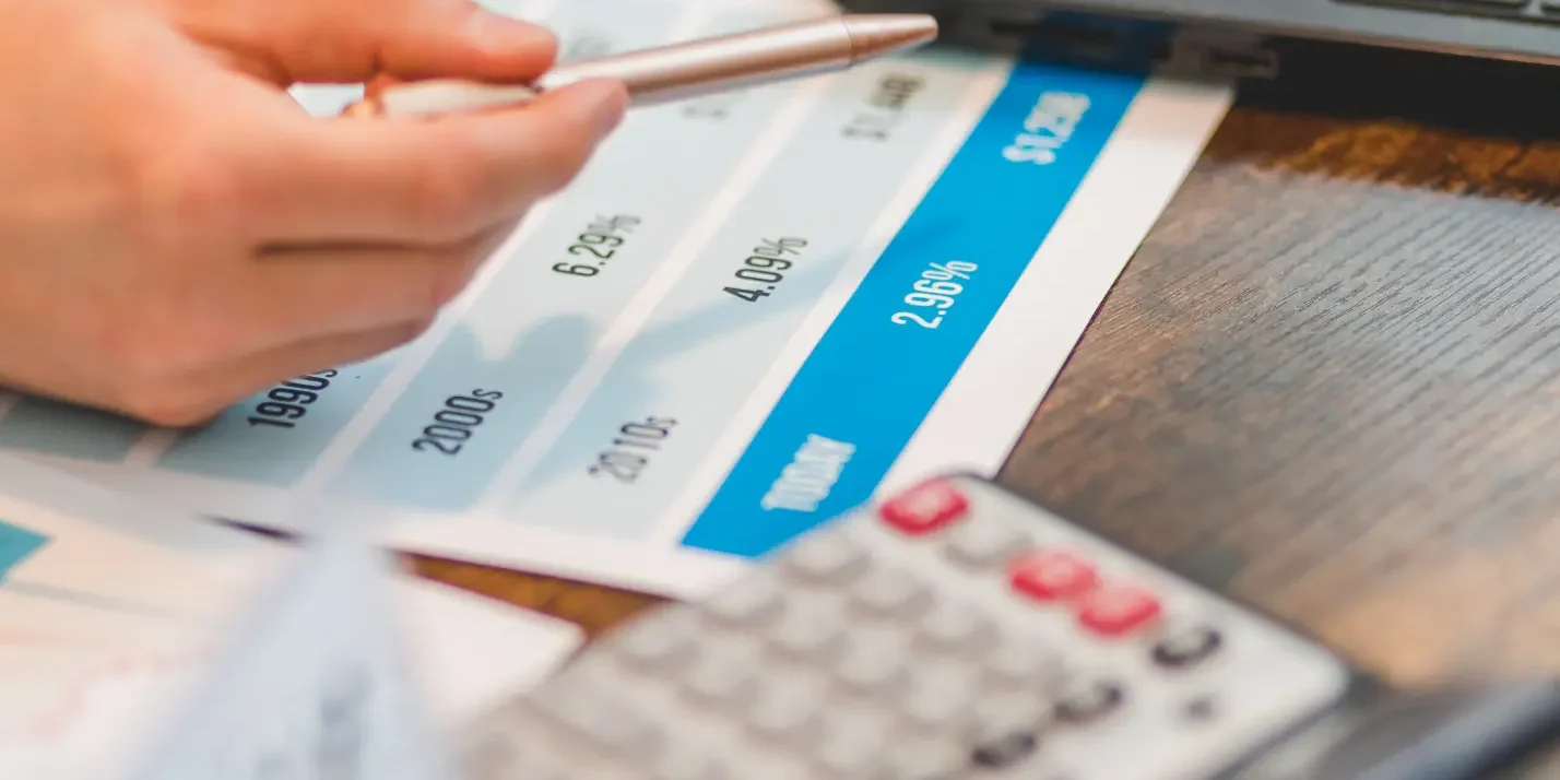 Finance professional reviewing AR and interest rate report