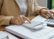 UK business owner managing HMRC tax accounts on laptop